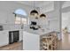 Bright kitchen featuring an island with seating and modern pendant lighting at 1071 N Danyell Dr, Chandler, AZ 85225