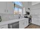Modern kitchen with a large window, sleek appliances, and bright white cabinetry at 1071 N Danyell Dr, Chandler, AZ 85225