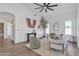 Cozy living room boasts modern decor, wood floors, and natural light from the windows at 1071 N Danyell Dr, Chandler, AZ 85225