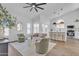 Bright living room features an open floorplan, modern lighting and decor, and wood flooring at 1071 N Danyell Dr, Chandler, AZ 85225