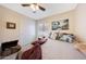 Cozy bedroom with comfortable bedding and a ceiling fan at 11207 W Turney Ave, Phoenix, AZ 85037