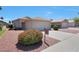 Charming single-story home with desert landscaping and a two-car garage at 11207 W Turney Ave, Phoenix, AZ 85037