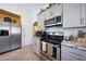Well-equipped kitchen with stainless steel appliances and neutral color cabinetry at 11207 W Turney Ave, Phoenix, AZ 85037