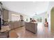 Spacious kitchen with stainless appliances, granite countertops and open layout to dining area at 11207 W Turney Ave, Phoenix, AZ 85037