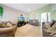 Comfortable living room with plush seating, neutral decor, and ample natural light at 11207 W Turney Ave, Phoenix, AZ 85037