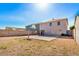 Backyard with a basketball hoop and a house at 11836 W Rosewood Dr, El Mirage, AZ 85335