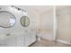 Bathroom features a double vanity, shower, and a tub at 11836 W Rosewood Dr, El Mirage, AZ 85335