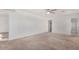 Spacious carpeted bedroom with a sliding door and an open doorway at 11836 W Rosewood Dr, El Mirage, AZ 85335