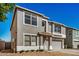 Inviting two-story home featuring a neutral stucco exterior, attached garage, and well-maintained front yard at 11836 W Rosewood Dr, El Mirage, AZ 85335