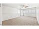 Upstairs loft area with large windows offering abundant light and neutral carpet at 11836 W Rosewood Dr, El Mirage, AZ 85335