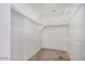 Walk-in closet with carpet and shelving at 11836 W Rosewood Dr, El Mirage, AZ 85335