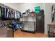 Walk-in closet with built-in shelving, hanging racks, and a safe for secure storage at 11958 W Villa Chula Ln, Sun City, AZ 85373