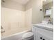 Neat bathroom with bright natural light and a shower-tub combo at 13439 W Desert Ln, Surprise, AZ 85374