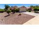 Well-kept home with a two-car garage and desert-friendly landscaping at 13439 W Desert Ln, Surprise, AZ 85374