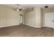 Bright living area with wood flooring, tall ceilings and natural lighting at 13439 W Desert Ln, Surprise, AZ 85374