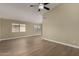 The living room features new wood flooring and neutral colors at 13439 W Desert Ln, Surprise, AZ 85374