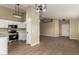 Bright, open living room with new laminate flooring and stylish light fixtures at 13439 W Desert Ln, Surprise, AZ 85374
