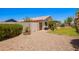Expansive backyard with gravel, lawn, mature trees, and patio with outdoor seating at 13824 N 148Th Ln, Surprise, AZ 85379