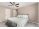 Comfortable bedroom with a ceiling fan and neutral decor at 13824 N 148Th Ln, Surprise, AZ 85379