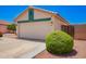 Single Gathering house featuring a two-car garage and low maintenance landscaping at 13824 N 148Th Ln, Surprise, AZ 85379