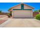 Single Gathering house featuring a two-car garage and well-kept landscaping at 13824 N 148Th Ln, Surprise, AZ 85379