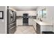 Bright kitchen features stainless steel appliances, tile backsplash, and ample counter space at 13824 N 148Th Ln, Surprise, AZ 85379