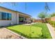 Beautiful backyard featuring a custom putting green, perfect for golf enthusiasts and outdoor enjoyment at 14116 W Honeysuckle Dr, Surprise, AZ 85387