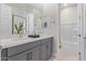 Modern bathroom with double sinks, stylish vanity, and shower-tub combination at 14116 W Honeysuckle Dr, Surprise, AZ 85387