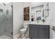 Modern bathroom with glass-enclosed shower, sleek vanity, and stylish fixtures at 14116 W Honeysuckle Dr, Surprise, AZ 85387