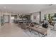 Open-concept living space with modern furnishings, kitchen, and ample seating areas at 14116 W Honeysuckle Dr, Surprise, AZ 85387