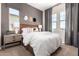 Comfortable bedroom featuring a soft color palette, modern decor, and natural lighting at 14124 W Honeysuckle Dr, Surprise, AZ 85387