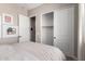 Bright bedroom featuring art, sliding door closet, and neutral colors at 14124 W Honeysuckle Dr, Surprise, AZ 85387