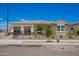 Beautiful single-story home with stone accents, desert landscaping, and a welcoming gated front yard at 14124 W Honeysuckle Dr, Surprise, AZ 85387