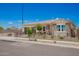 Inviting single-story home featuring stone accents, xeriscaping, and a welcoming gated front yard at 14124 W Honeysuckle Dr, Surprise, AZ 85387