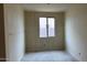 Bright bedroom featuring one window, drywall, and neutral wall paint at 15159 W Gray Fox Trl, Surprise, AZ 85387