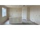 Bright living room featuring drywall, a large window providing natural light, and a modern interior door at 15159 W Gray Fox Trl, Surprise, AZ 85387