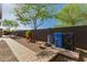 Landscaped backyard features desert plants, gravel, and a paver pathway, creating a low-maintenance outdoor space at 1526 E Hazel Dr, Phoenix, AZ 85042