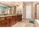 Primary bathroom featuring dual sinks with granite countertops, and walk-in shower at 1526 E Hazel Dr, Phoenix, AZ 85042