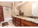 Bathroom features a double sink vanity with a large mirror and granite countertop at 1526 E Hazel Dr, Phoenix, AZ 85042