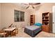 This bedroom has a desk, bookshelf, and cozy single bed at 1526 E Hazel Dr, Phoenix, AZ 85042