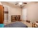 Spacious bedroom with built-in bookcases and neutral color palette at 1526 E Hazel Dr, Phoenix, AZ 85042