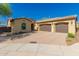 Charming single-story home featuring a three-car garage and desert landscaping at 1526 E Hazel Dr, Phoenix, AZ 85042