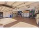 Spacious three car garage features epoxy floors, custom storage cabinets, and convenient organization systems at 1526 E Hazel Dr, Phoenix, AZ 85042