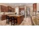 Gourmet kitchen featuring granite countertops, stainless steel appliances, and custom wood cabinetry at 1526 E Hazel Dr, Phoenix, AZ 85042