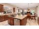 Open kitchen showcasing granite countertops and stainless steel dishwasher, seamlessly connected to dining area at 1526 E Hazel Dr, Phoenix, AZ 85042