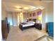 Expansive main bedroom featuring a king bed, sitting area, and plenty of natural light at 1526 E Hazel Dr, Phoenix, AZ 85042
