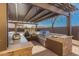 Outdoor kitchen and pergola with integrated grill, countertops and storage offer a perfect entertaining space at 1526 E Hazel Dr, Phoenix, AZ 85042
