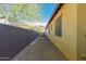 Paver walkway leads to a tranquil side yard with water feature and view of mountains in the distance at 1526 E Hazel Dr, Phoenix, AZ 85042
