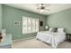Bedroom with a bed, shutters, and a ceiling fan at 18021 N 53Rd St, Scottsdale, AZ 85254