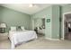 Cozy bedroom with neutral carpet, ceiling fan, and sliding mirror closet doors at 18021 N 53Rd St, Scottsdale, AZ 85254